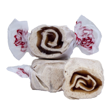 Taffy Town’s Cinnamon Roll taffy candy with a brown sugar swirl in creamy white—whipped salt water taffy with warm, bakery-inspired flavor.